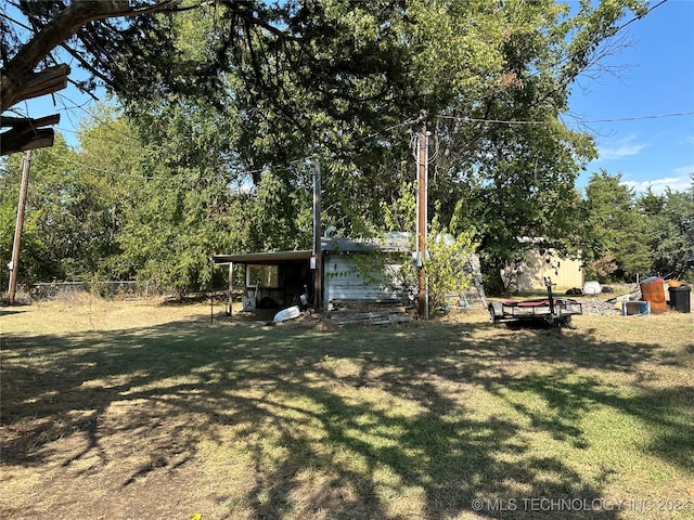 view of yard with a carport