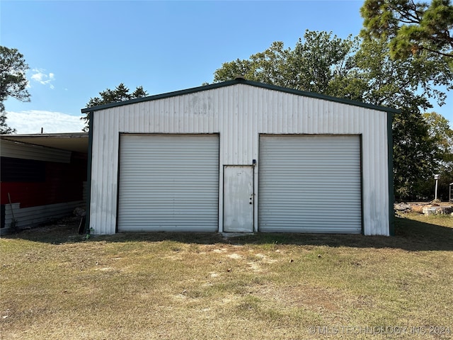 garage with a lawn