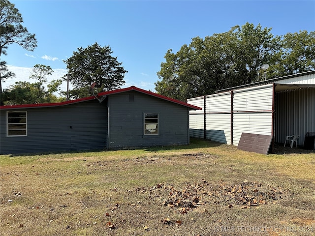 view of property exterior with a yard