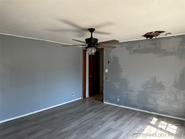 unfurnished room featuring hardwood / wood-style flooring and ceiling fan