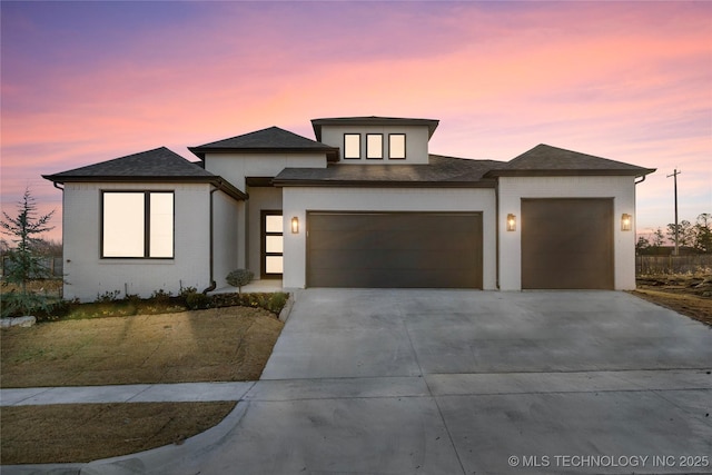 prairie-style house featuring a garage