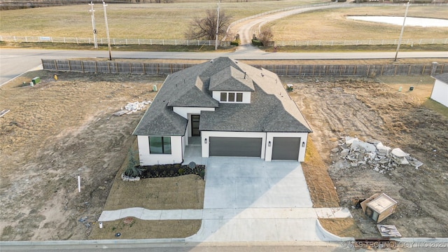 view of front of home featuring a rural view and a garage