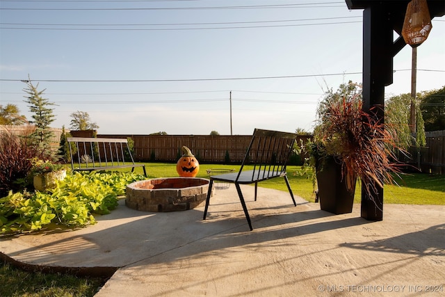 view of patio / terrace with a fire pit