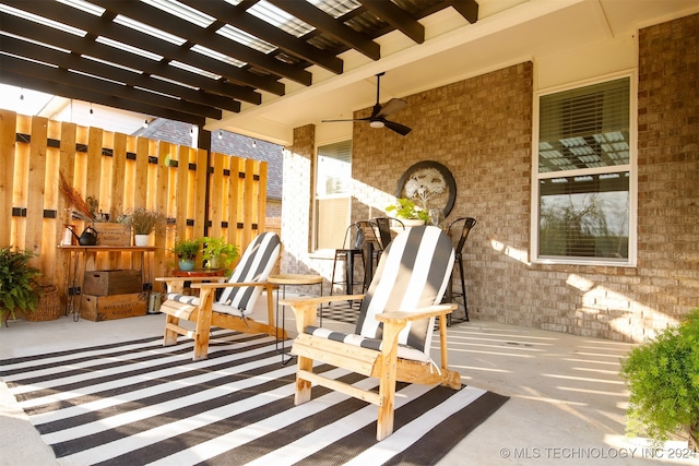 view of patio / terrace featuring a pergola and ceiling fan