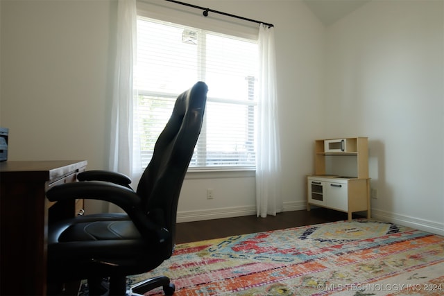 office space with dark hardwood / wood-style flooring and vaulted ceiling