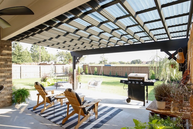 view of patio with ceiling fan, a grill, and a pergola