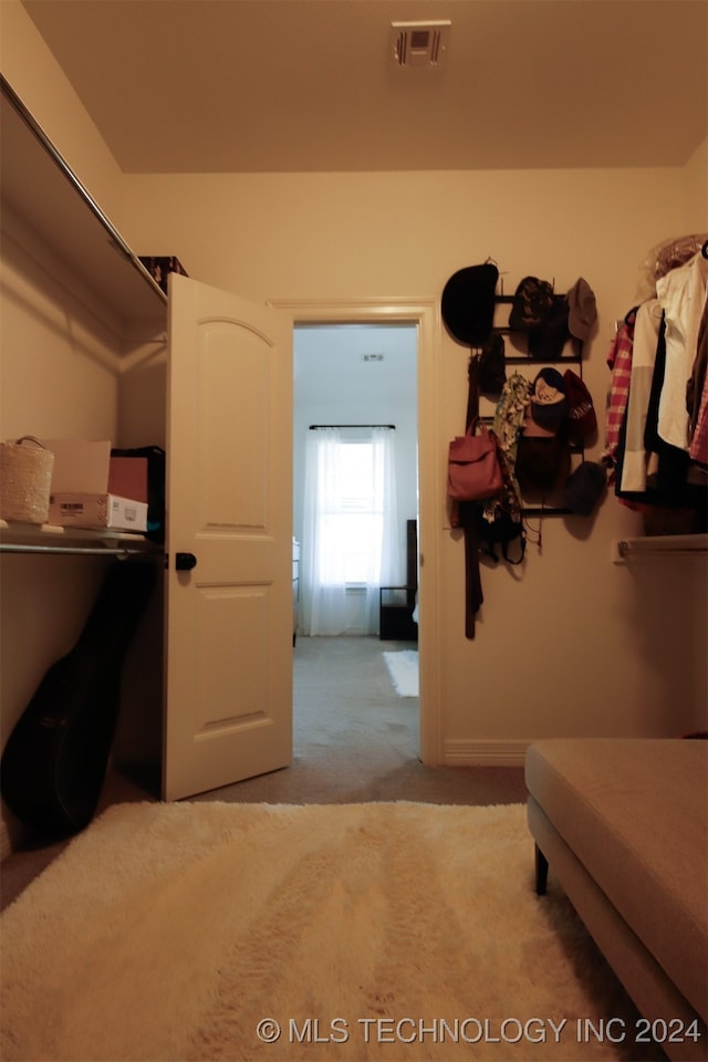 bedroom featuring light carpet