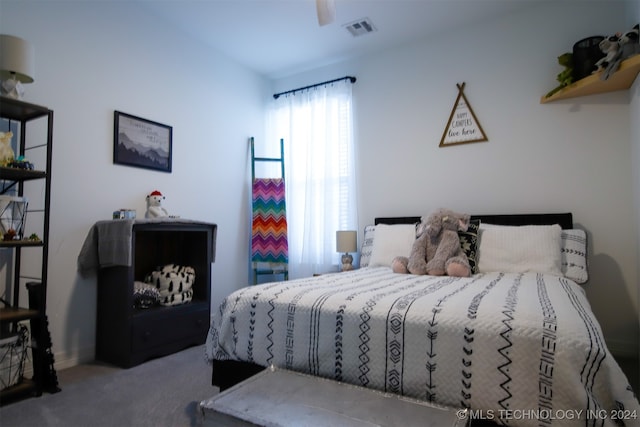 carpeted bedroom with ceiling fan