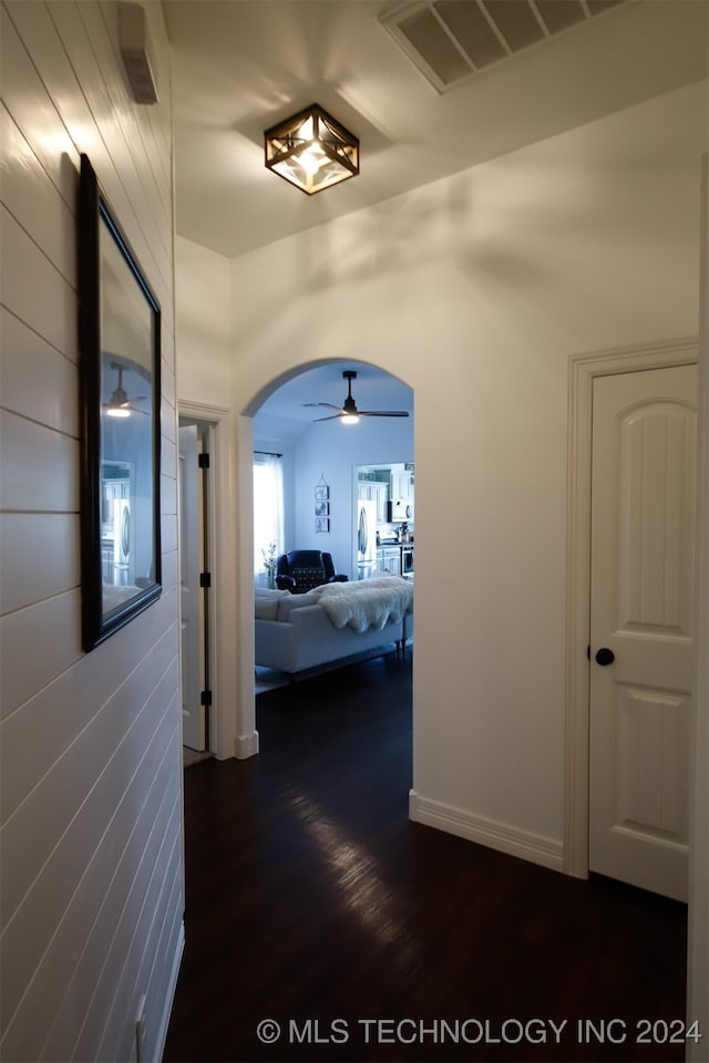 corridor featuring dark wood-type flooring