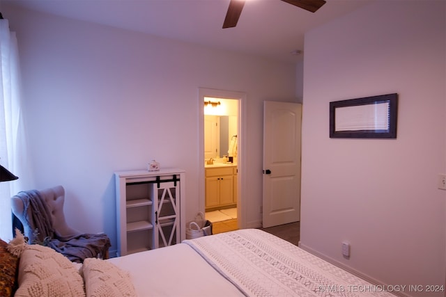 bedroom with ensuite bath, ceiling fan, and sink