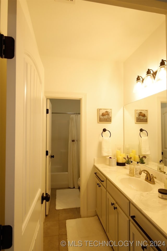 bathroom with tile patterned floors, a shower with curtain, and vanity