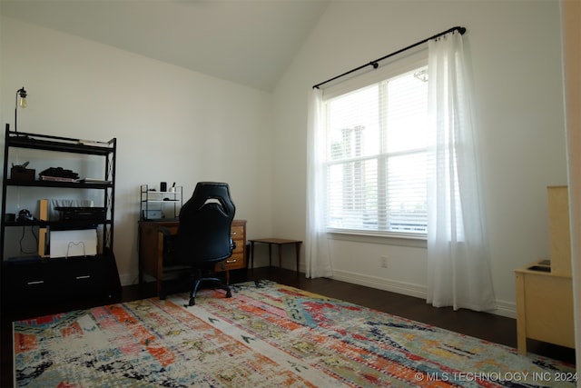 office with dark hardwood / wood-style floors and vaulted ceiling