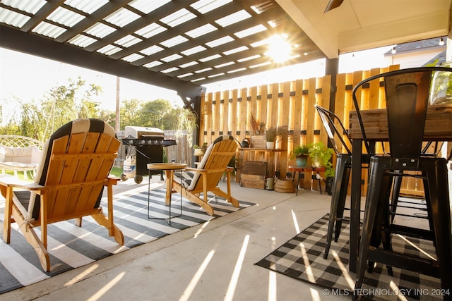 view of patio featuring a pergola and a grill