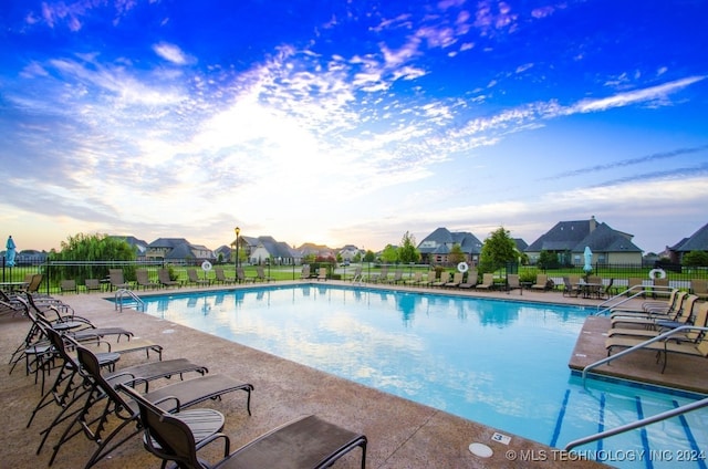 view of swimming pool with a patio