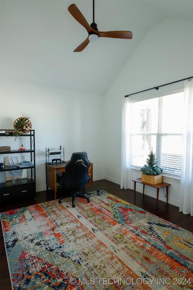 office featuring dark hardwood / wood-style floors, ceiling fan, and vaulted ceiling