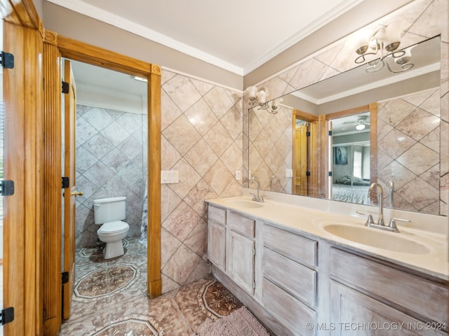 bathroom with tile walls, ornamental molding, vanity, and toilet