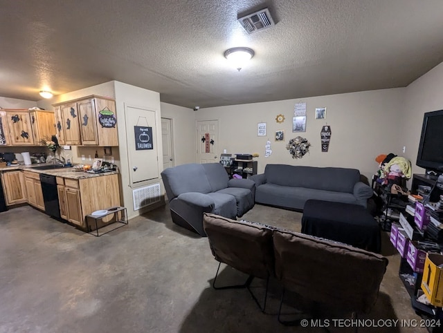 living room featuring sink and a textured ceiling