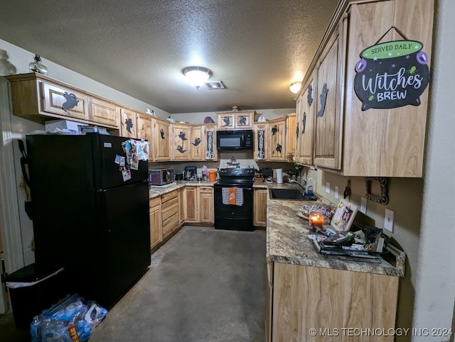 kitchen featuring light brown cabinetry, black appliances, sink, and a textured ceiling