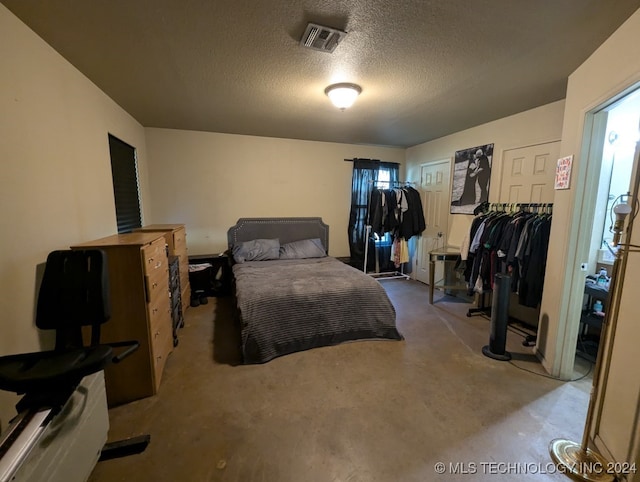 bedroom featuring a textured ceiling