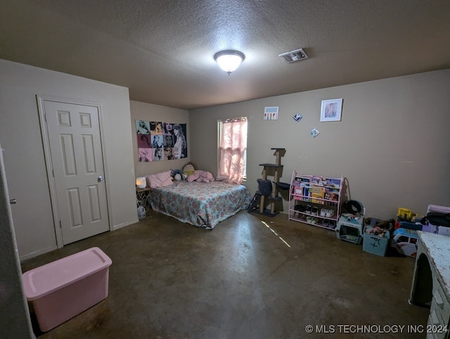 bedroom featuring a textured ceiling