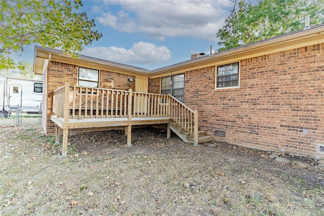 20515 S 4450, Vinita, OK 74301 - back of property with brick siding, a deck, a chimney, and fence