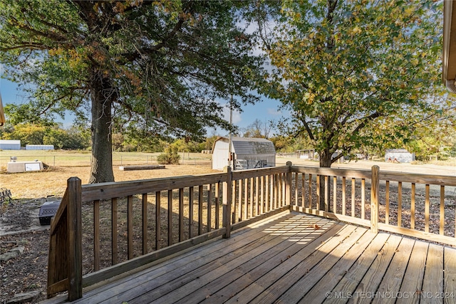 wooden deck with a storage unit