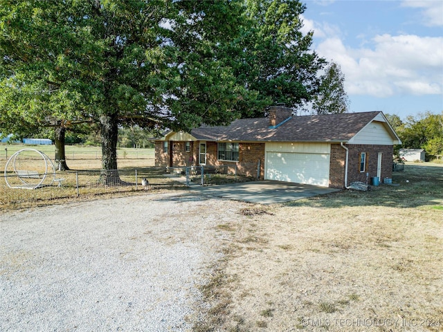 20515 S 4450, Vinita, OK 74301 - view of front of home featuring brick siding, driveway, an attached garage, and a chimney