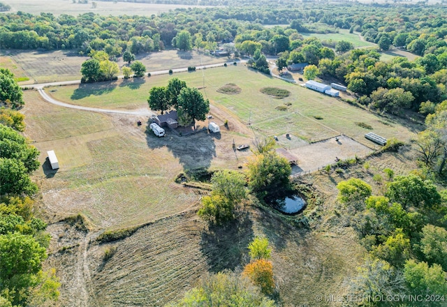 birds eye view of property with a rural view