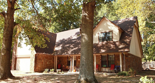 view of front of property featuring a garage and covered porch