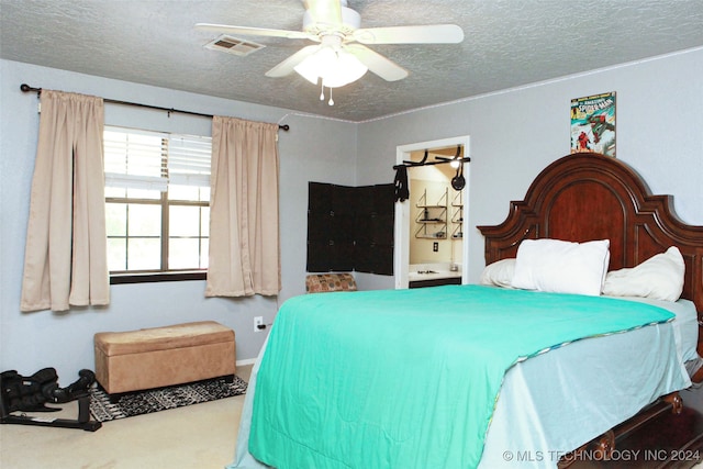 bedroom with carpet flooring, ceiling fan, and a textured ceiling