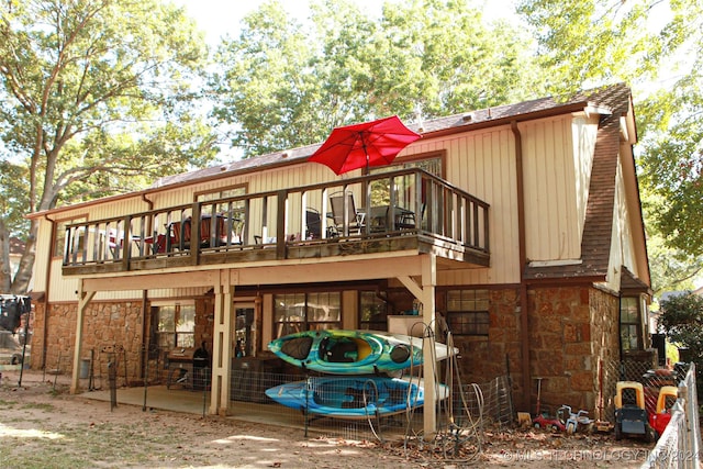 rear view of house with a balcony