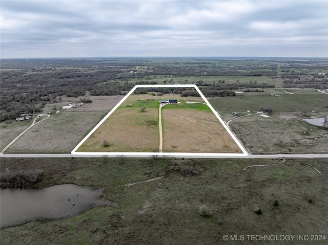 birds eye view of property featuring a rural view