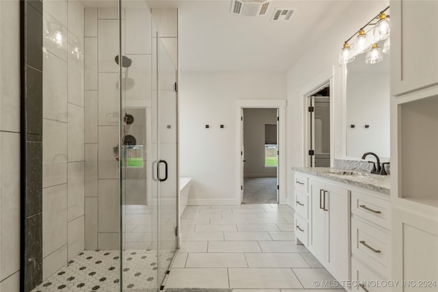 bathroom with vanity, separate shower and tub, and tile patterned floors