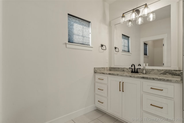 bathroom with tile patterned floors and vanity