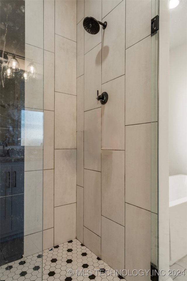 bathroom featuring shower with separate bathtub