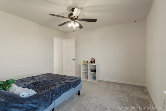 bedroom featuring light carpet and ceiling fan