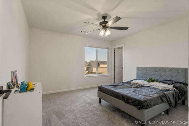 bedroom featuring ceiling fan and carpet