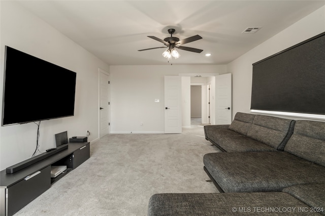 living room featuring ceiling fan and light carpet