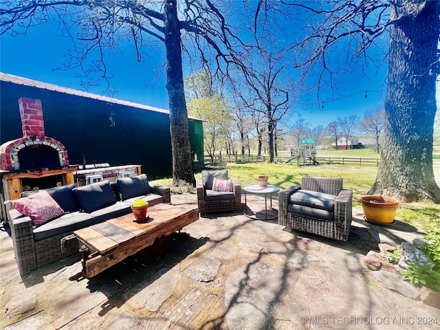 view of patio / terrace featuring a playground and outdoor lounge area