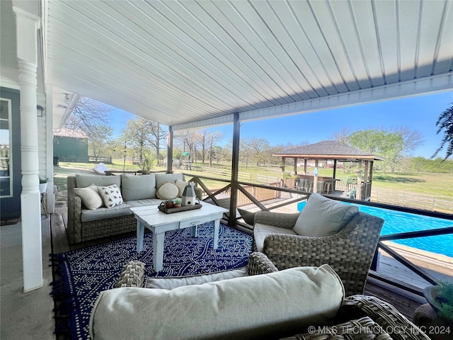 view of patio with a gazebo, an outdoor hangout area, and a pool side deck