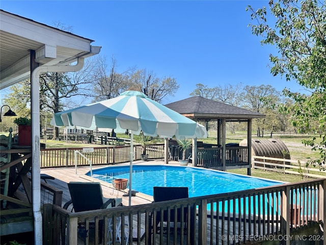 view of pool with a wooden deck