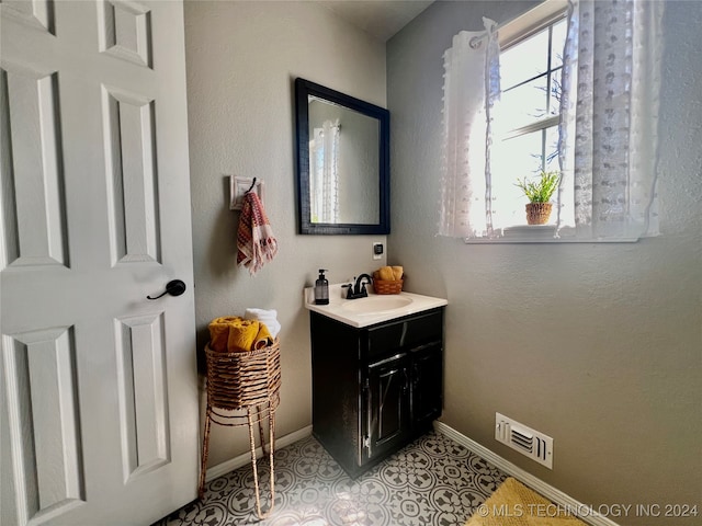 bathroom with vanity and tile patterned flooring