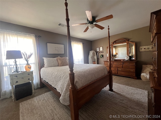 bedroom with light carpet and ceiling fan