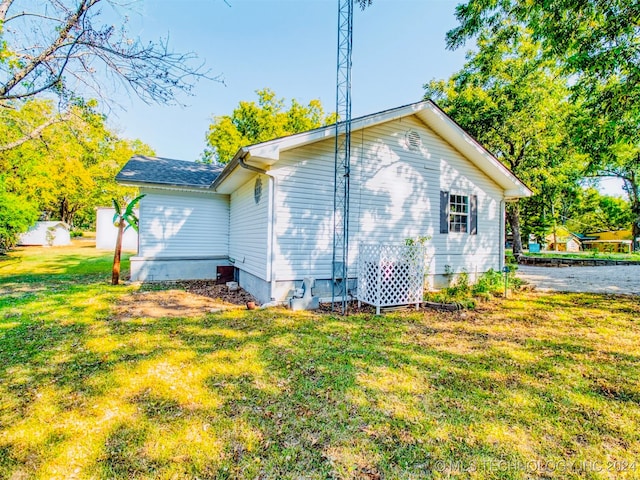 view of home's exterior featuring a lawn