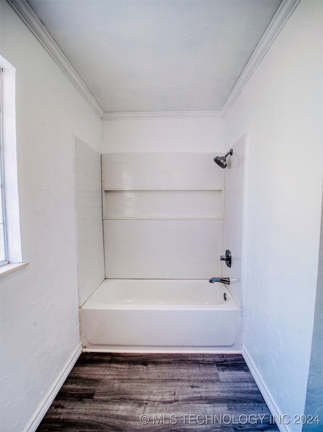 bathroom featuring wood-type flooring, crown molding, and  shower combination