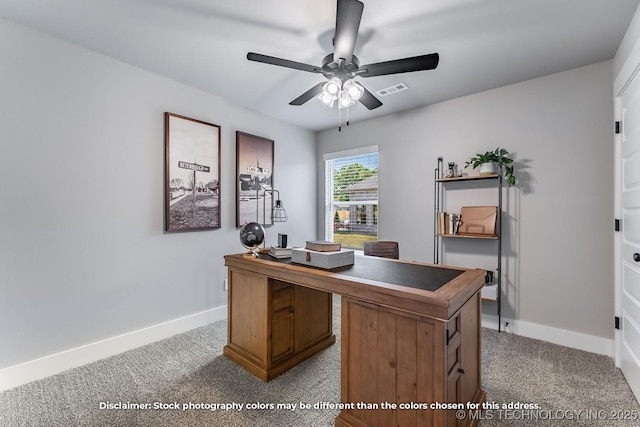 office featuring visible vents, carpet, a ceiling fan, and baseboards