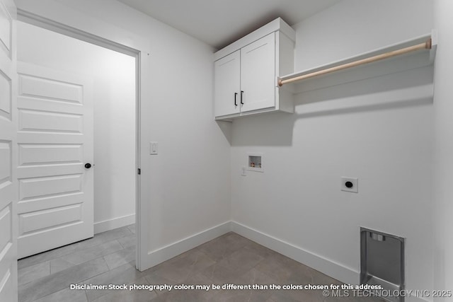 clothes washing area with hookup for an electric dryer, light tile patterned flooring, baseboards, hookup for a washing machine, and cabinet space