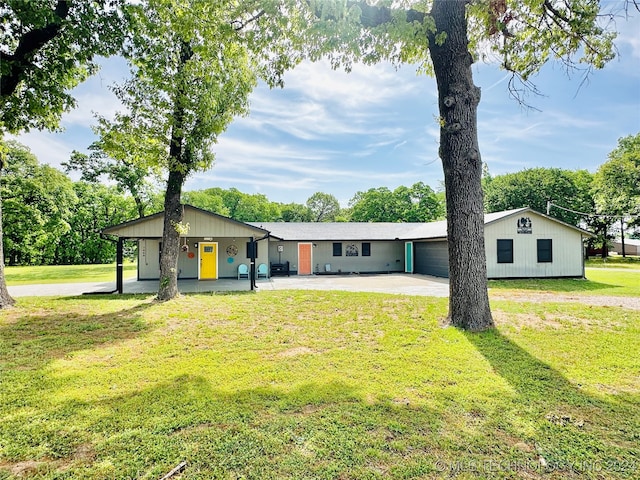 ranch-style house featuring a garage and a front yard