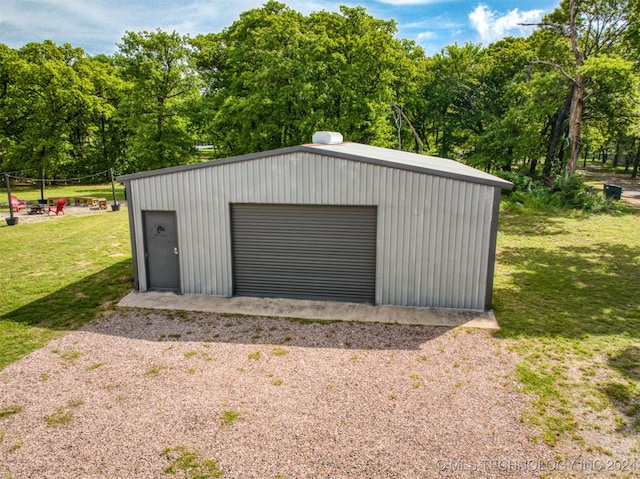 garage featuring a lawn