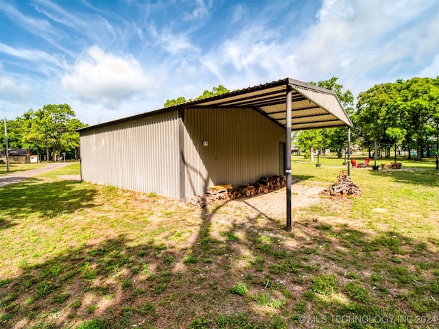 view of outbuilding with a lawn